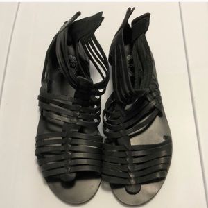 Black gladiator sandals by Ecote